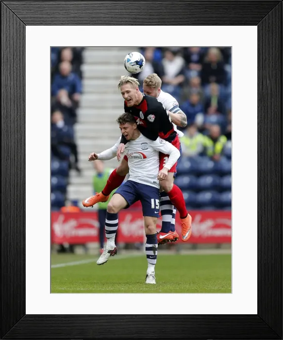 Framed Print : Sebastian Polter vs Calum Woods and Tom Clarke: Intense Moment in Preston North End vs Queens Park Rangers Championship Clash