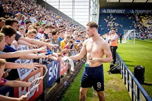 Championship Prints: Alan Brown Present Match Shirt To Young Fan