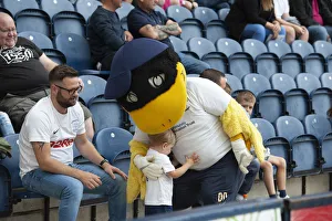 Football Prints: The Deepdale Duck receives A Little Hug